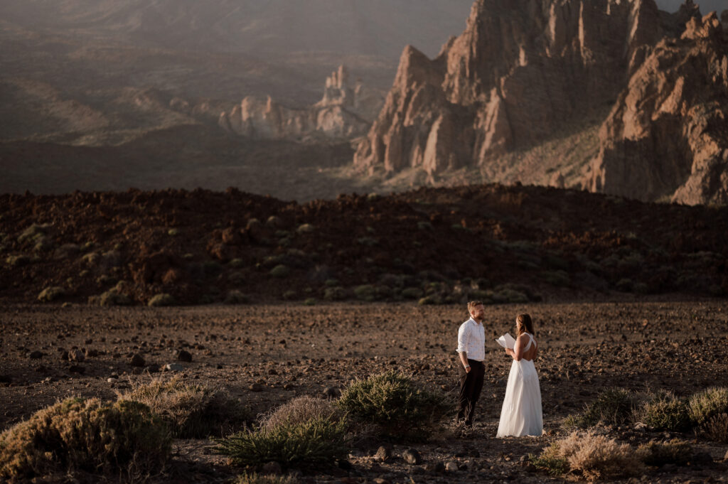 wedding couple reading vows on a vulcanic landscape on tenerife