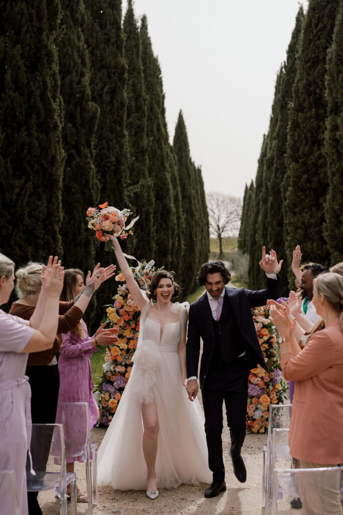 couple walking away after ceremony in Italy