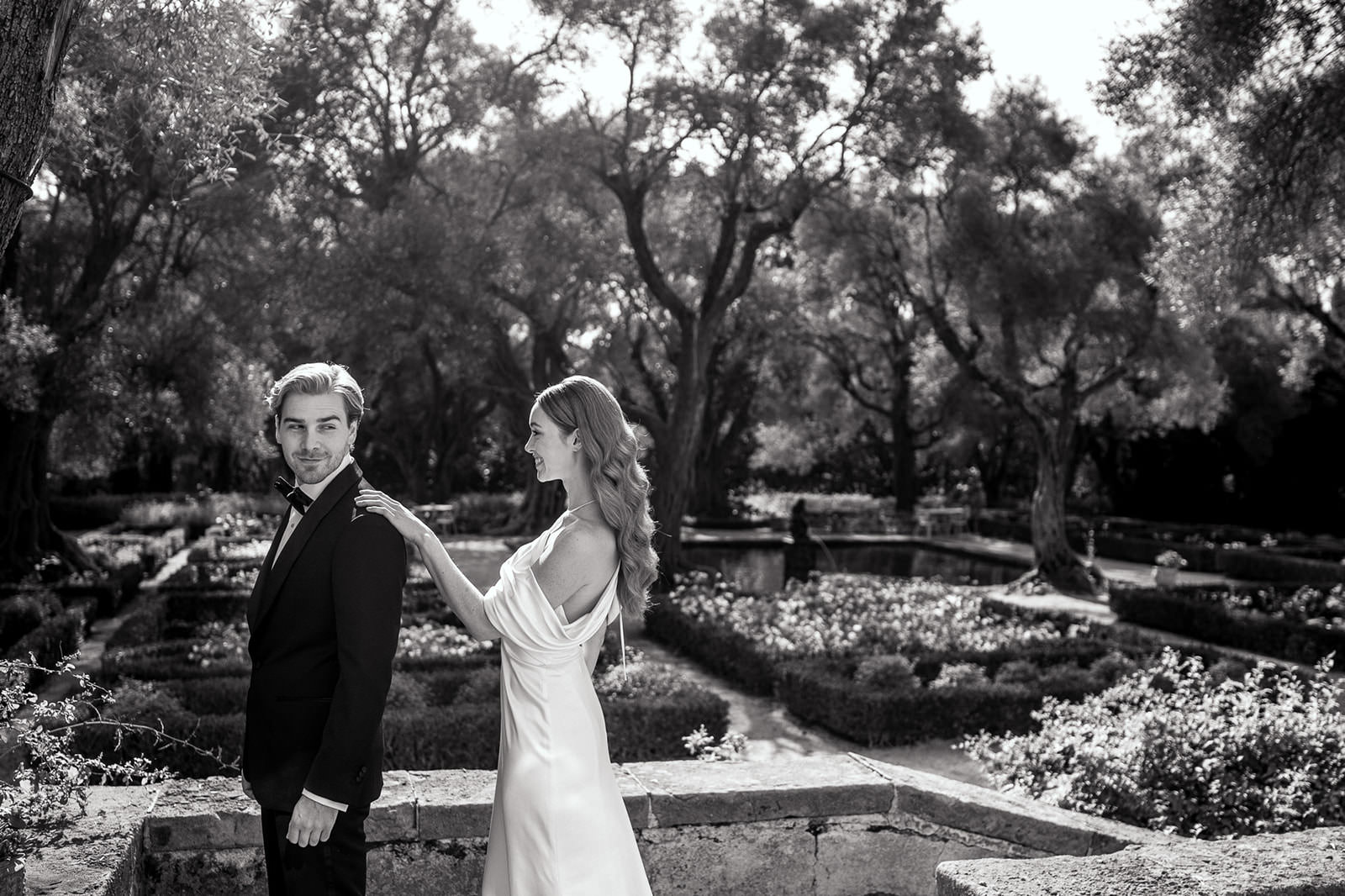 Bride walking up to groom for first look and tapping on the shoulder