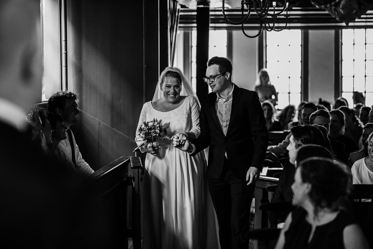 Bride walking to her Wedding ceremony at Ons’ Lieve Heer op Solder