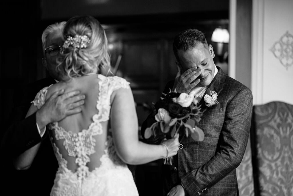 groom crying when bride enters with dad