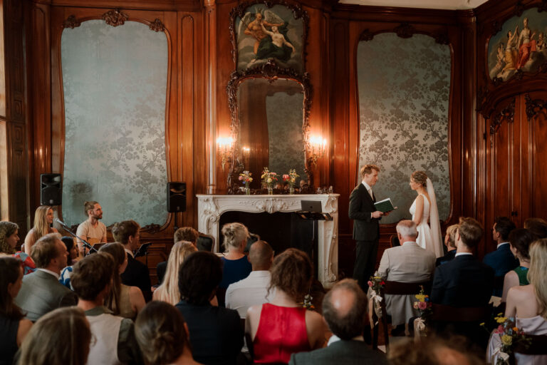 Couple exchanging vows in Amsterdam wedding venue