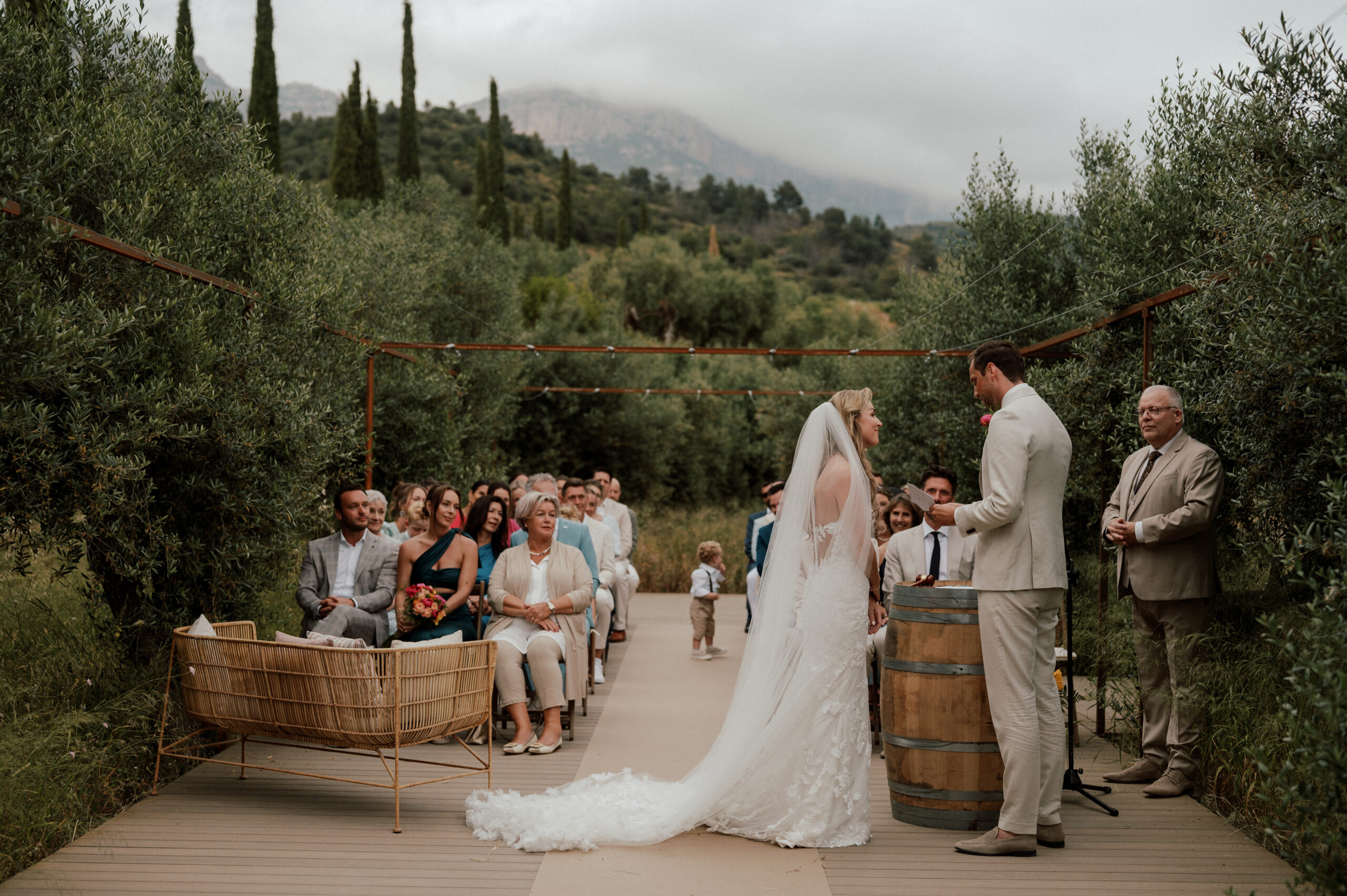 couple saying I do in front of guests, wedding photographer