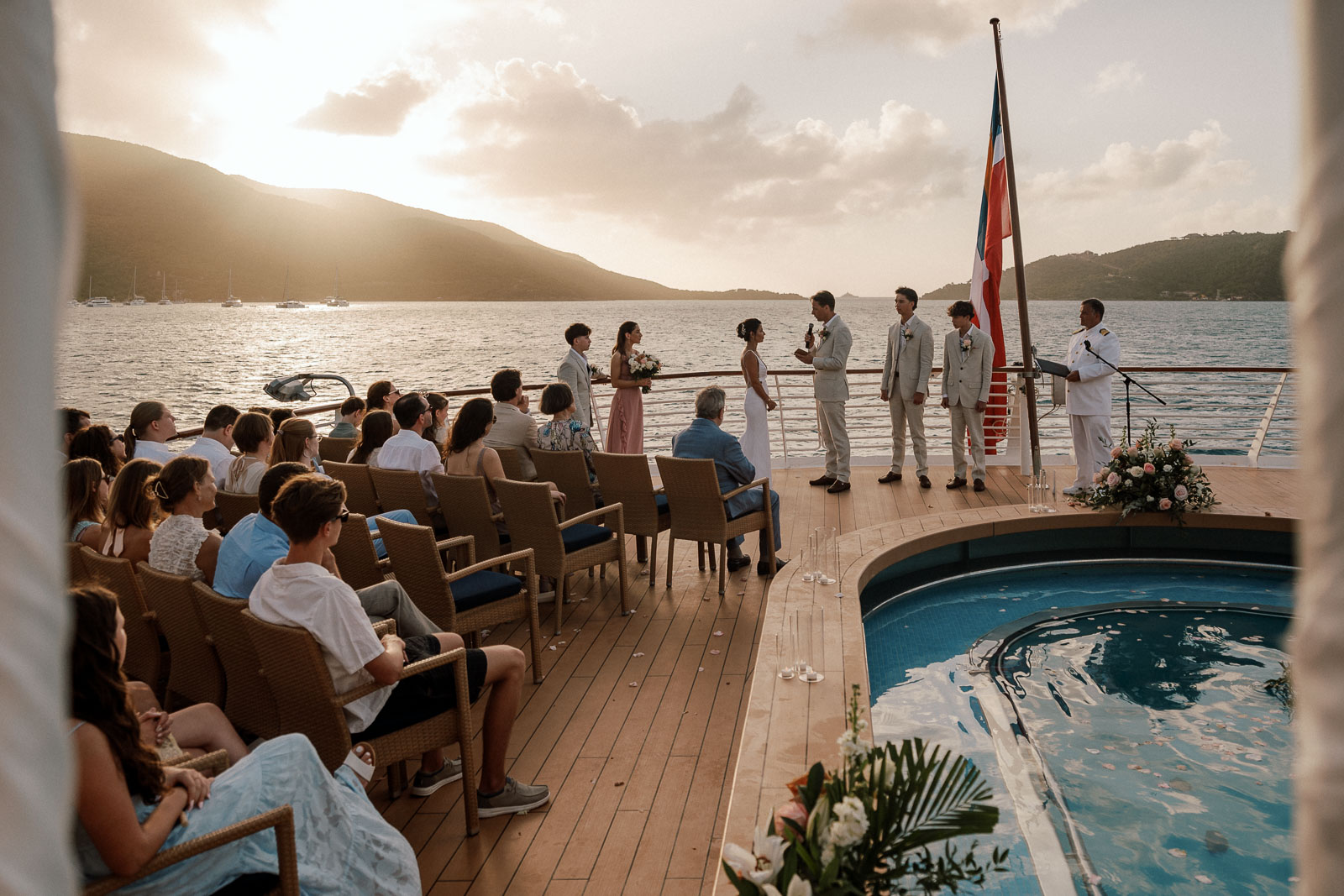 Destination wedding ceremony on SeaDream yacht deck in St Barths at sunset